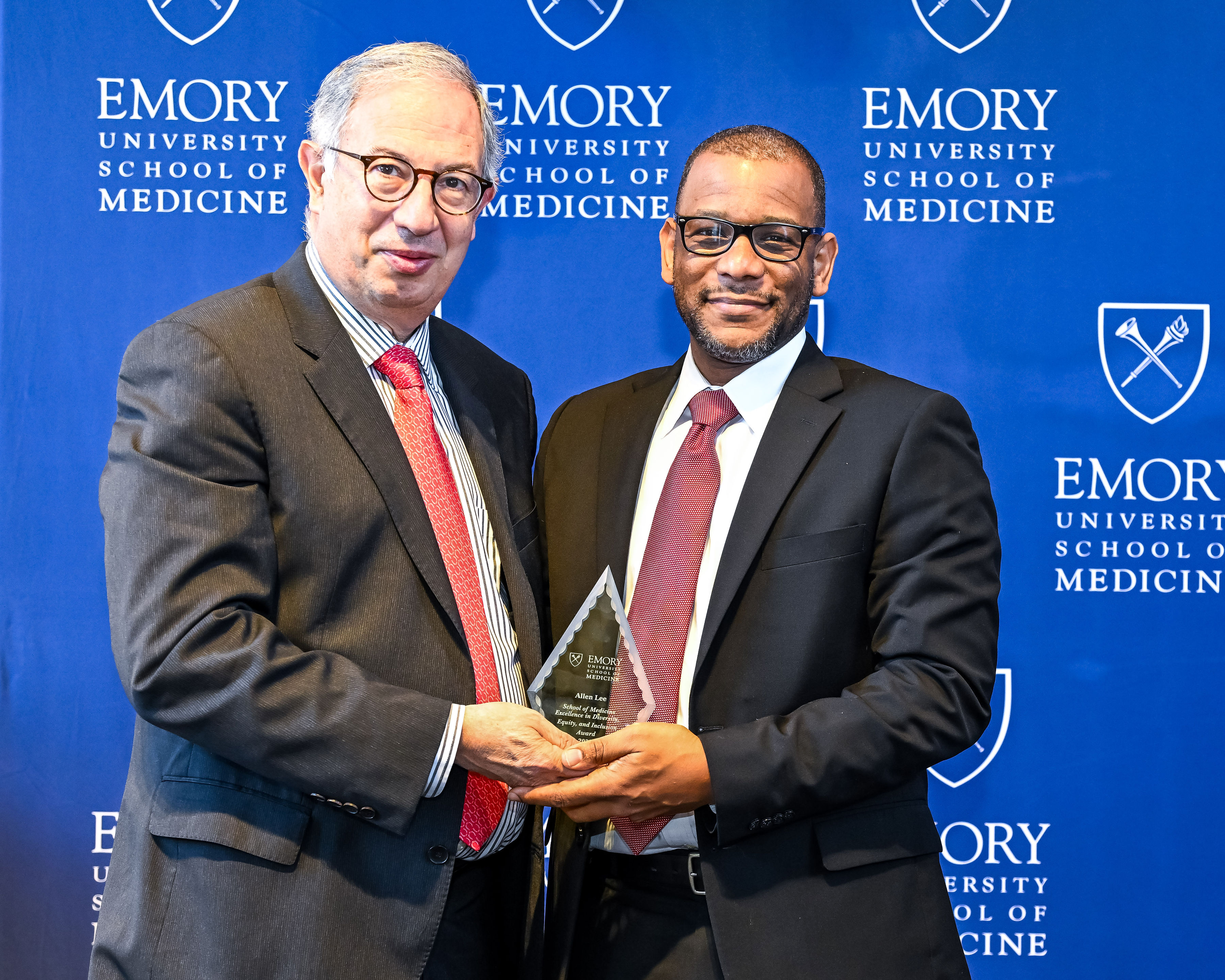 Allen Lee accepting his award with interim Dean del Rio