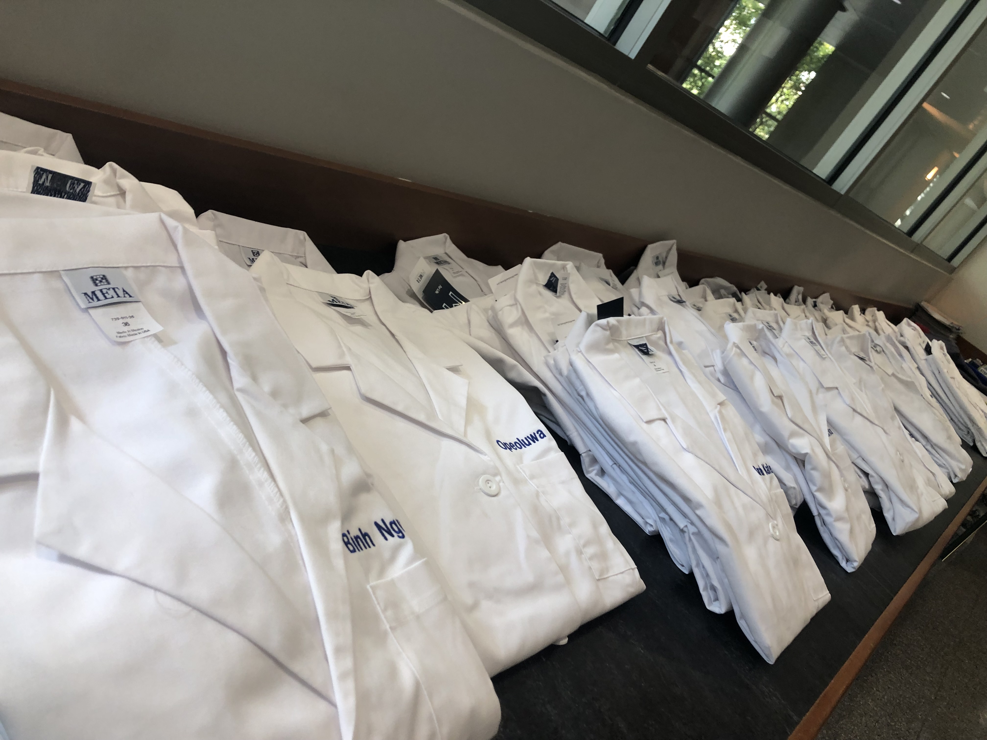 stacks of white coats