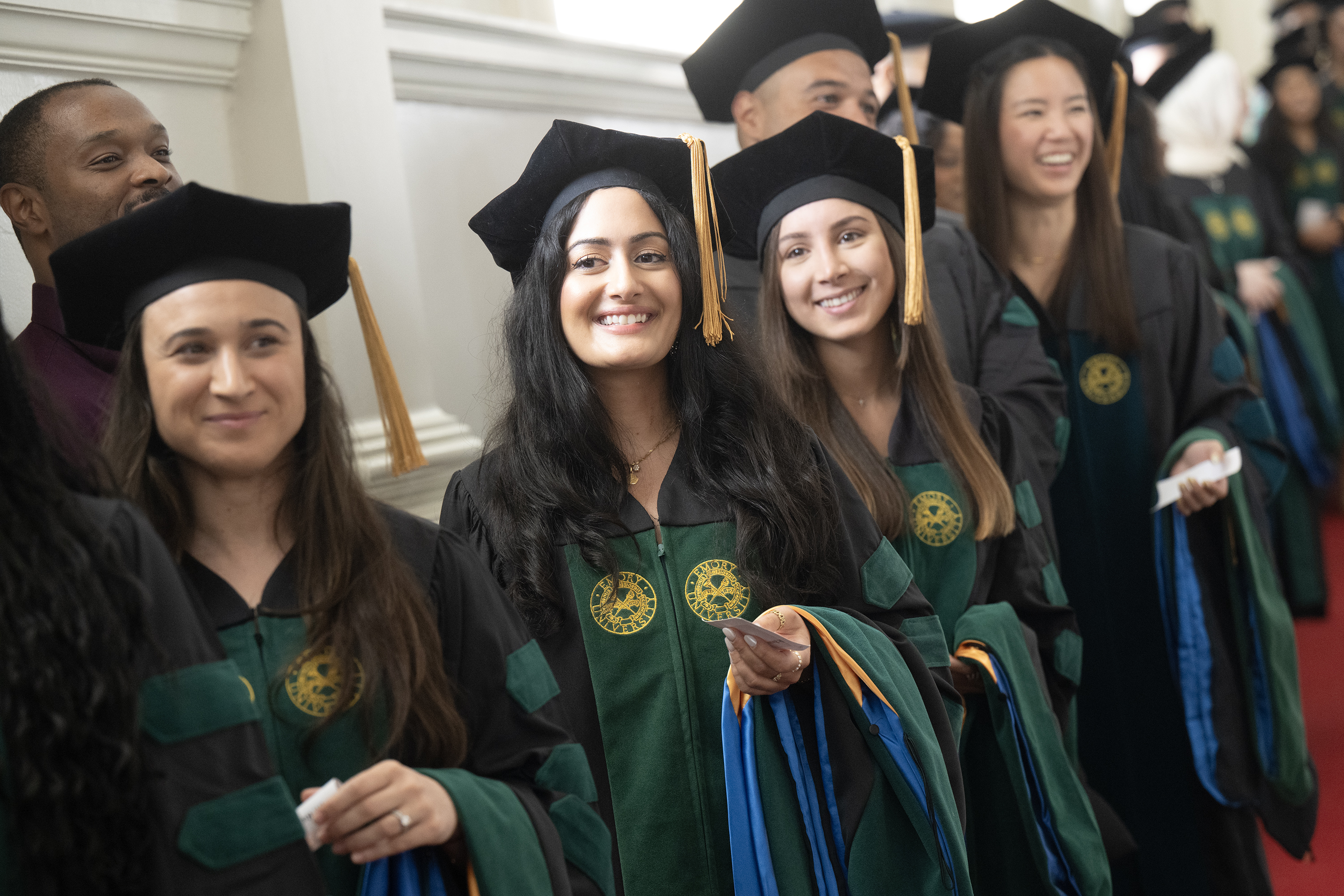 graduates lined up inside