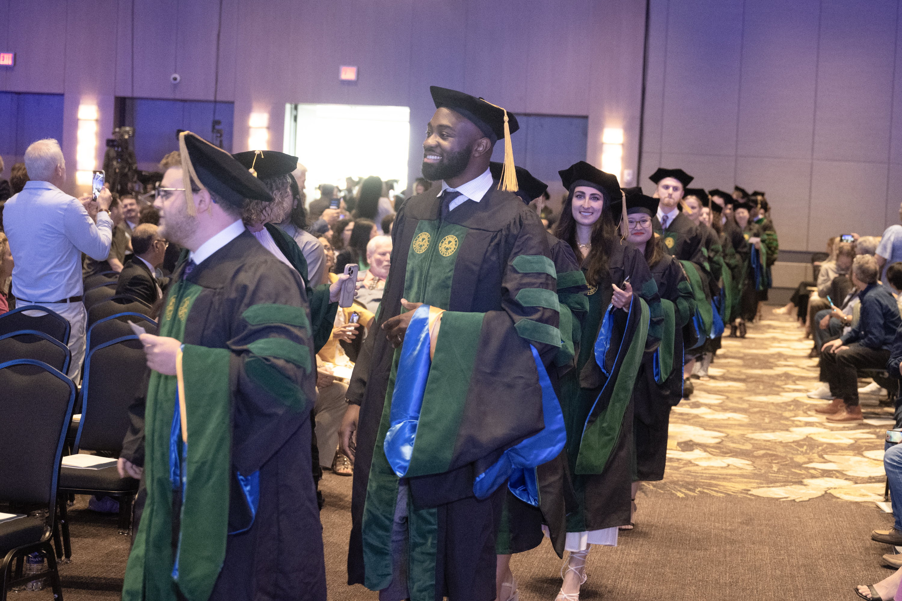 Graduates in cap and gown lined up