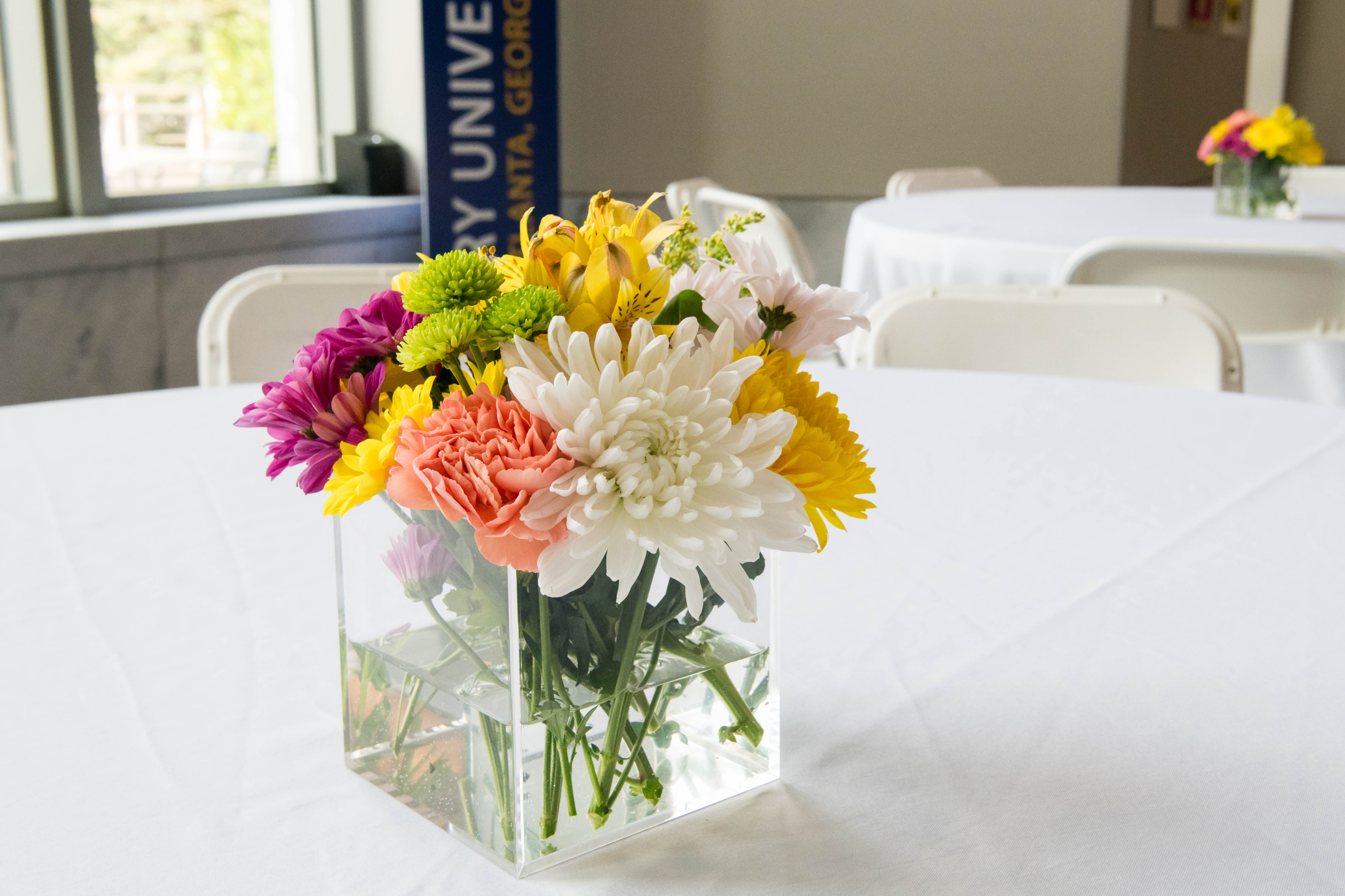 Close up photo of flowers on a table. 
