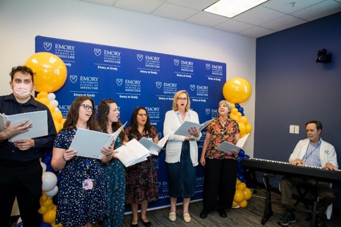 Emory at Grady choir singing. 