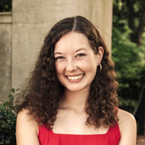 headshot of woman in red shirt