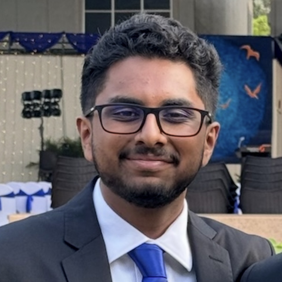 headshot of man in a suit