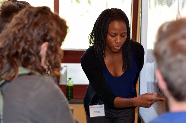 Dr. Denise Okafor presents her poster at the 2016 SER-CAT Symposium