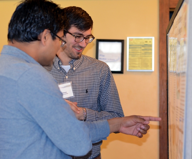 Matthew Tillman presents his poster to Dr. Manoj Khadka at the 2016 SER-CAT Symposium