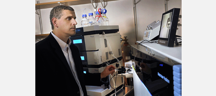 Dr. Nicholas T. Seyfried with lab equipment