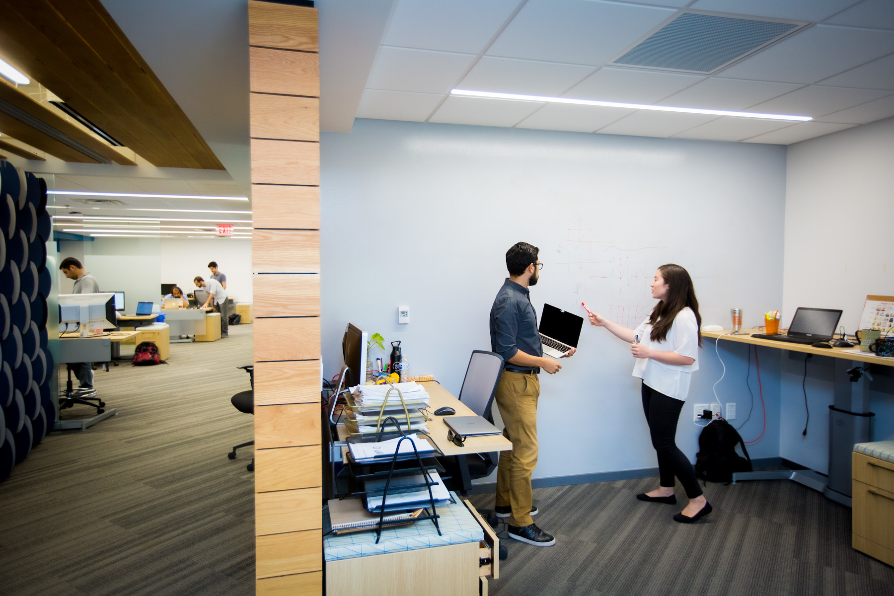 small groups working in office space