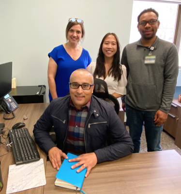 Emergency Medicine Team Members Heather Miller, Cynthia Chac, Kelvin Dillard, and seated Galileu Carvalho