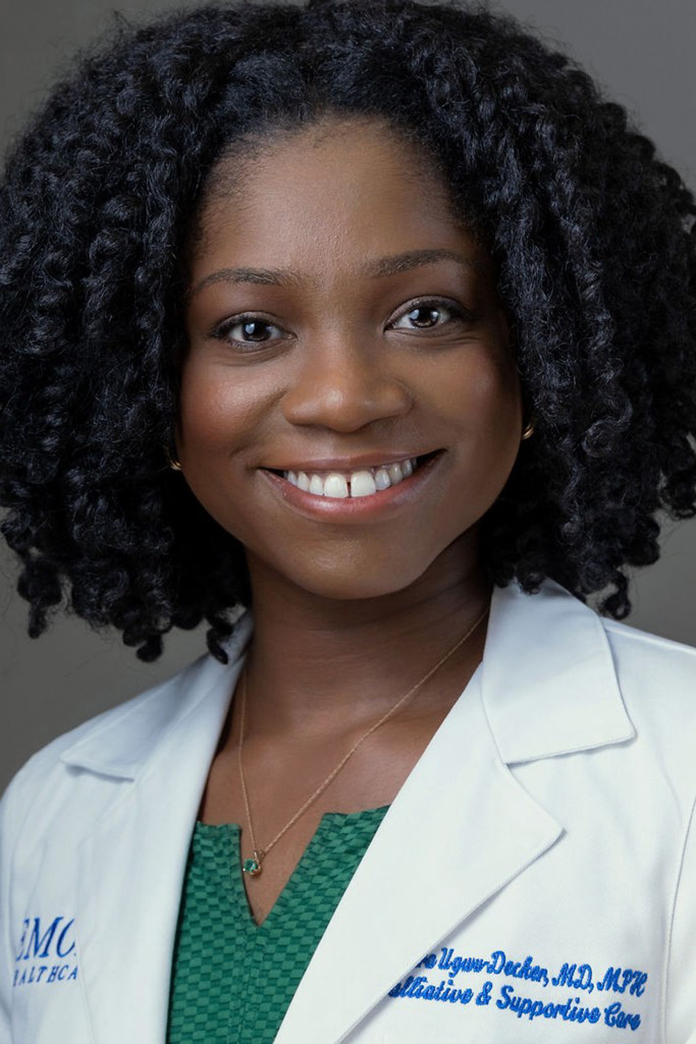 Dr. Amara Decker in white coat