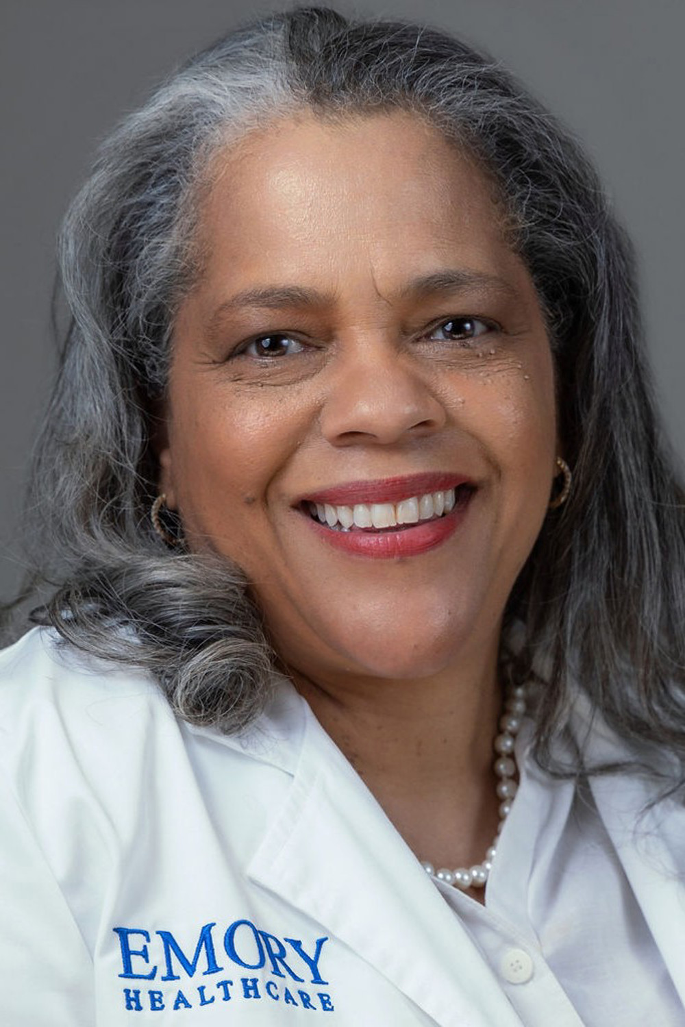 Dr. Tammie Quest in white coat