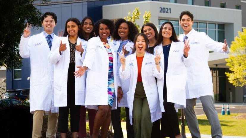 class of 2026 interns in front of Dunwoody FM building