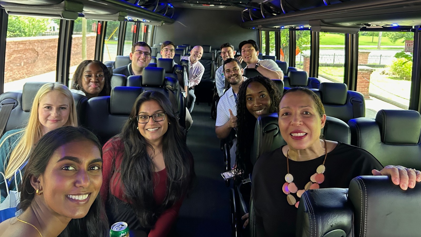 group of family medicine residents and faculty on a charter bus