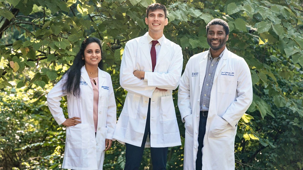 Drs. Gandrakota, Holterman, and Johnson standing in white coats