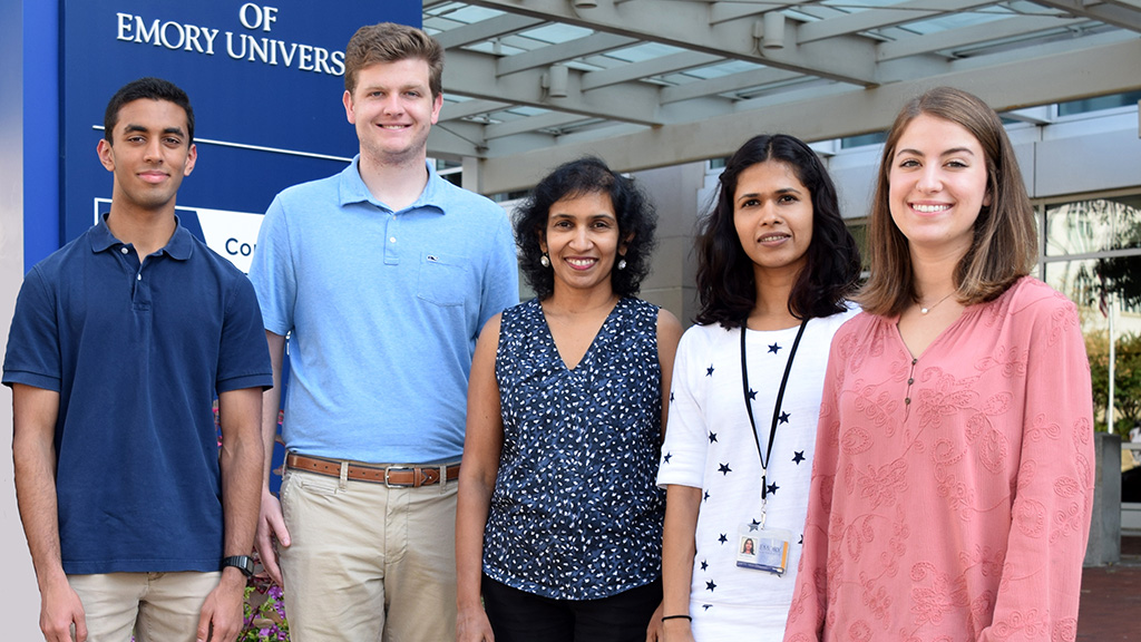 Group image of Shanmugam lab team outside of Winship Cancer Institute.