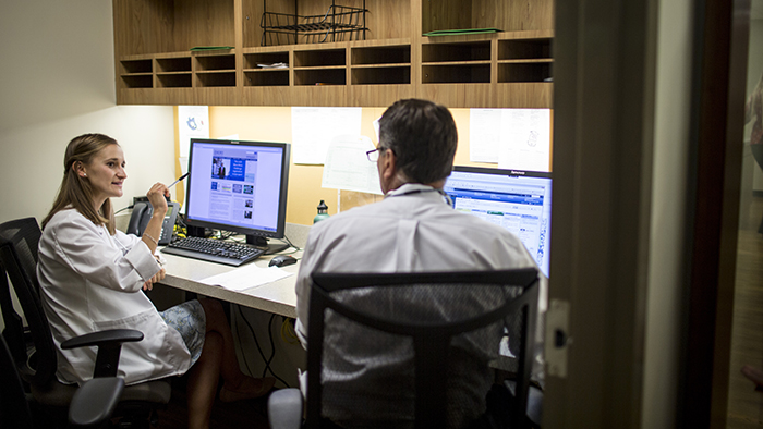 Faculty on computer in Seavey Clinic