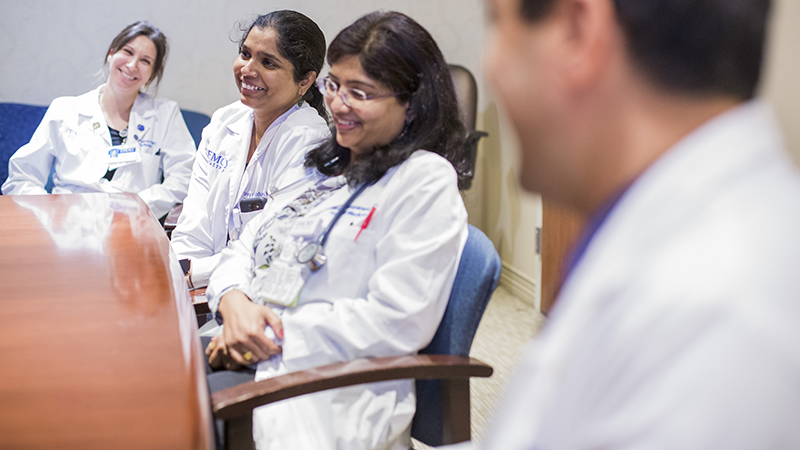 Women faculty in a conference room