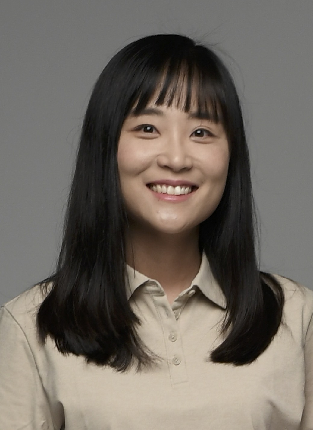 headshot of woman with black hair