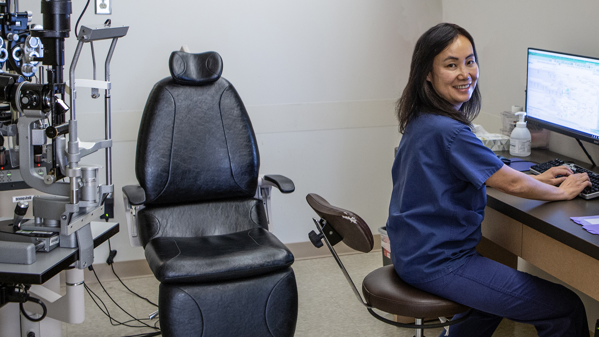 Emory Eye Center physician Alexa Lu at her desk