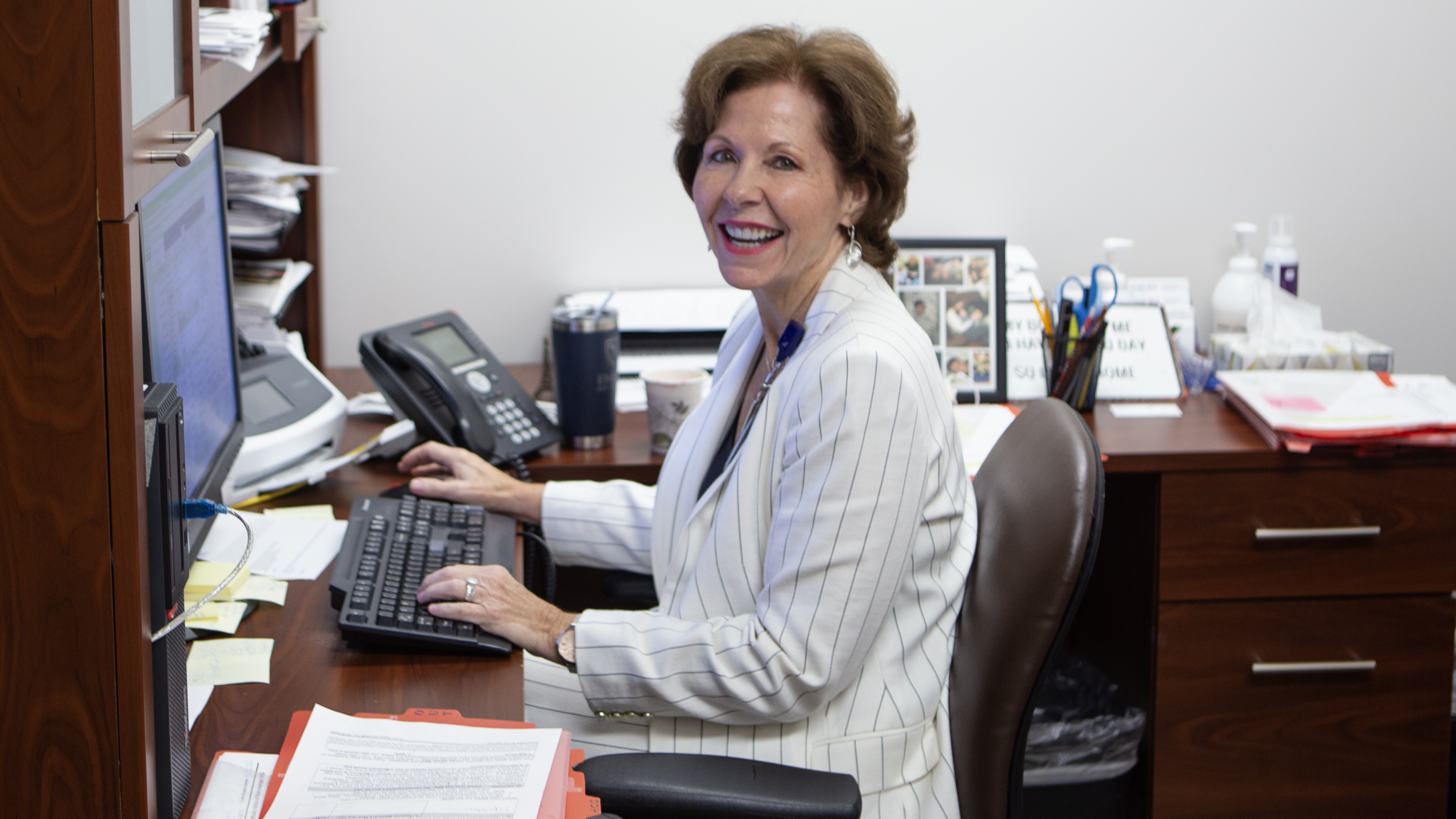 Emory Eye Center staffer Melanie Smith at her desk