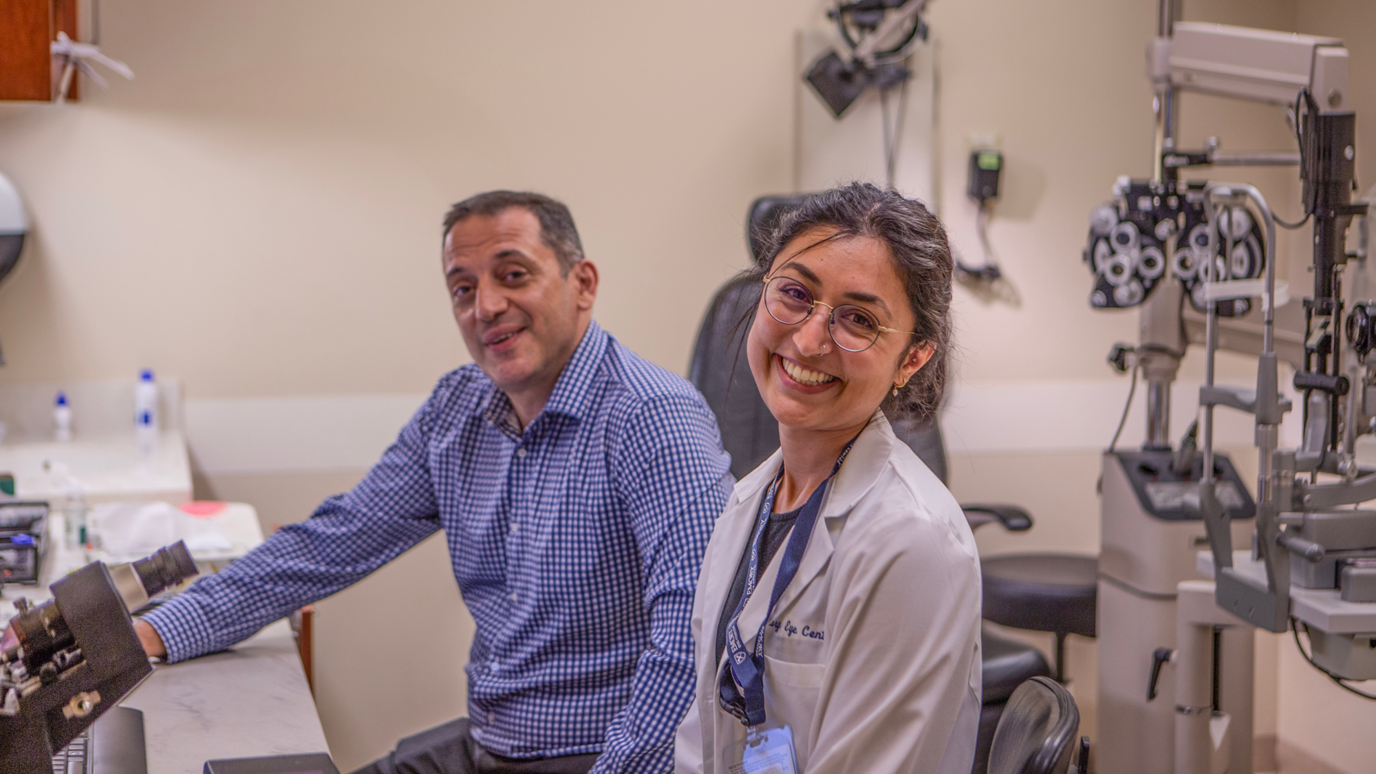 Dr. Severinsky (background) sitting next to Emory's first optometric resident