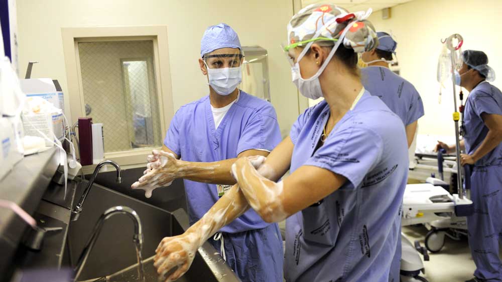 Faculty and resident surgeons preparing for the operating room. 