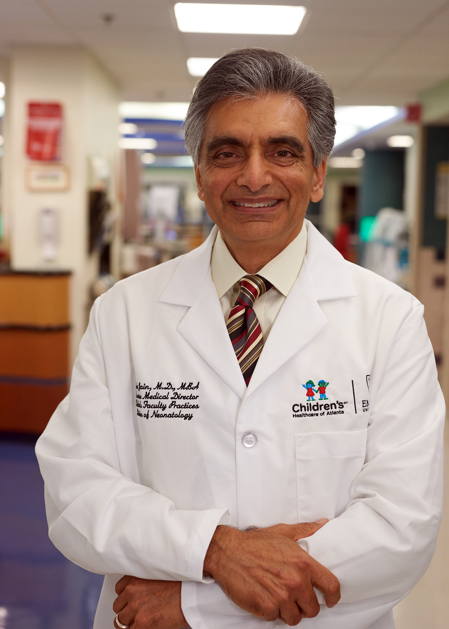 Dr. Lucky Jain, Department Chair, standing in hospital