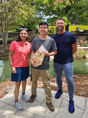 Drs. Kesarwala and Orthwein present Yifan with winning prize.