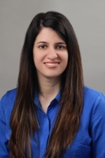 smiling person wearing a blue blouse