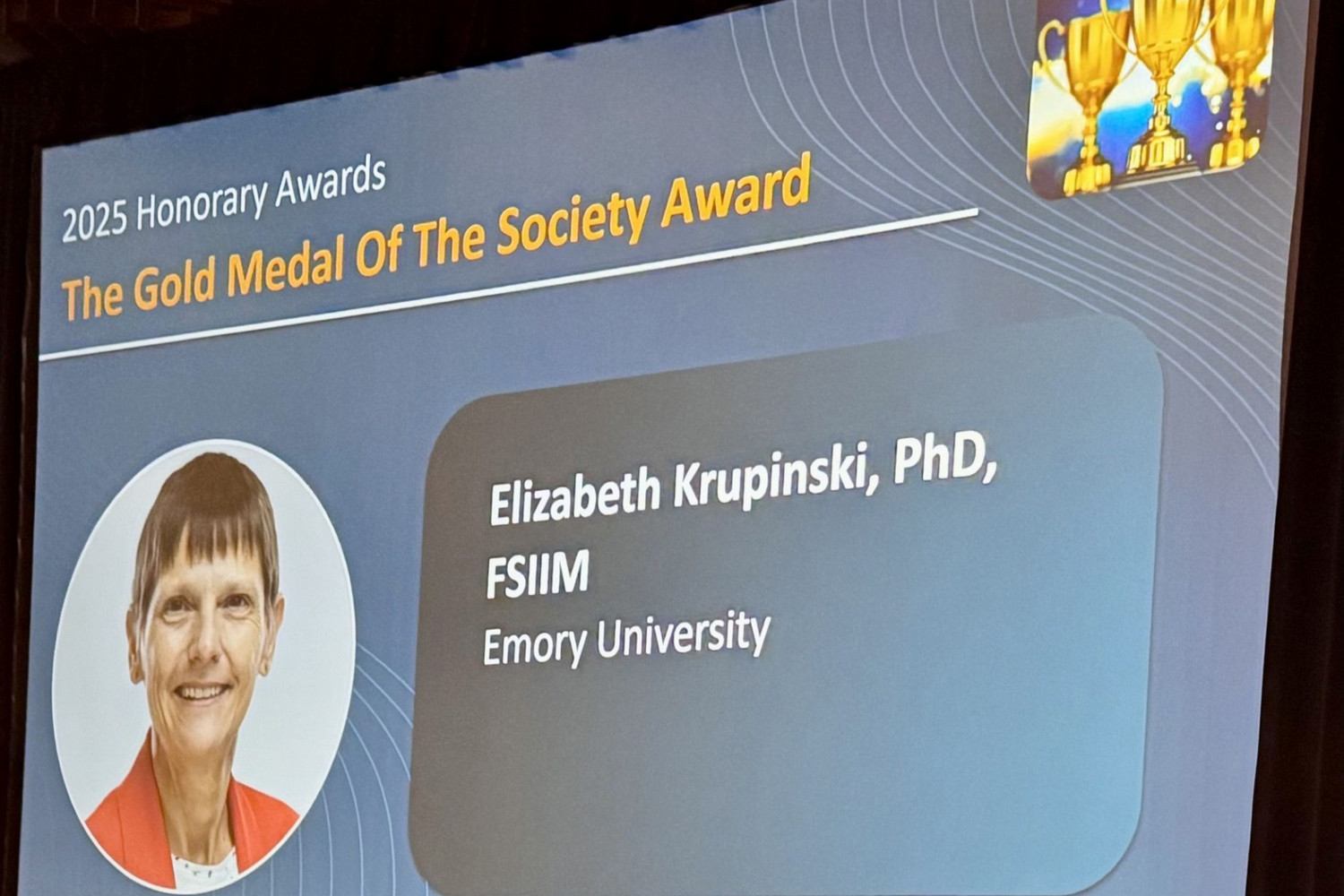 slide with smiling person photo and "SIIM Gold Medal Elizabeth Krupinski"