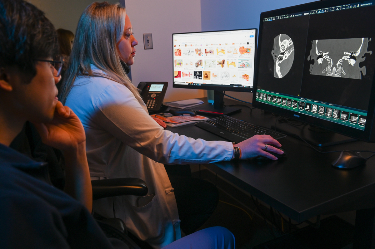 two people looking at images on a screen