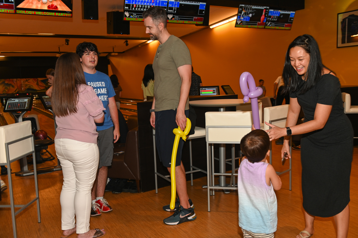 people talking in a bowling alley