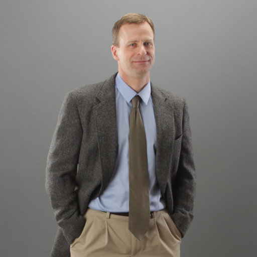 man standing with sport coat and tie