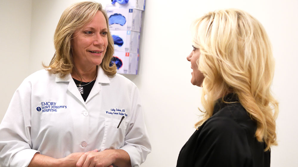 Dr. Cathy Graham consults with a patient.