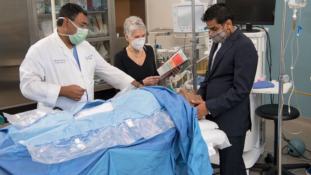 Faculty engaged in simulation scenario training.