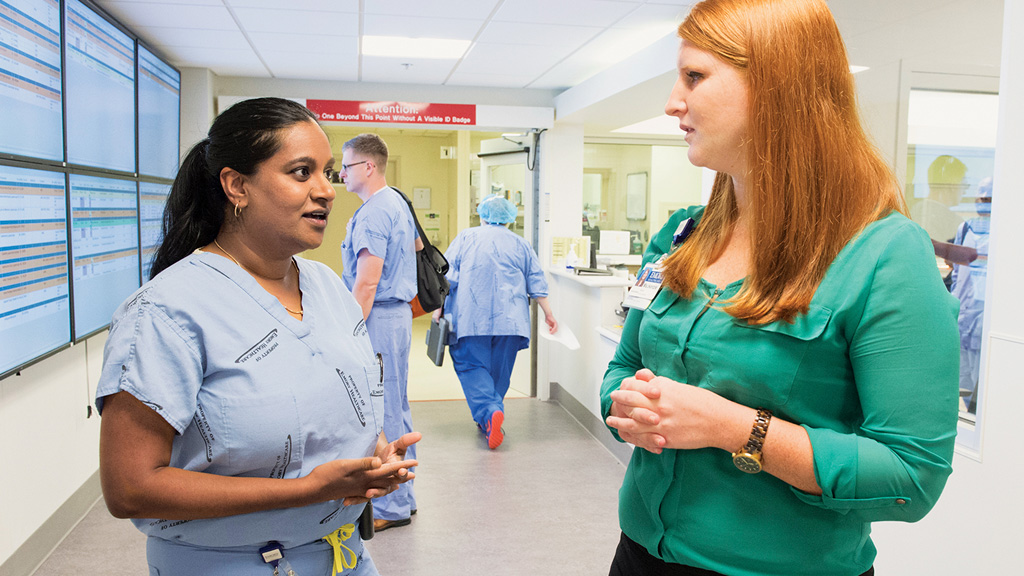Dr. Srinivasan speaks with an operating room administrator.
