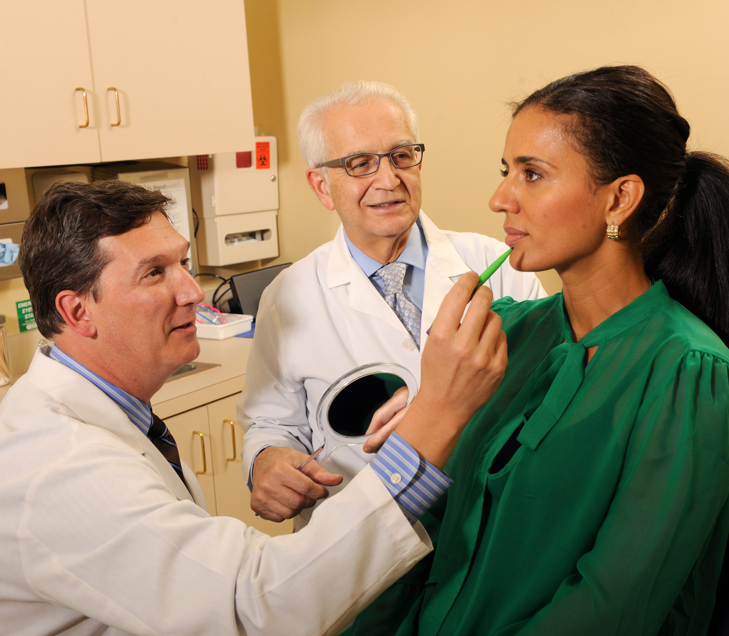 Drs. Felmont Eaves and Foad Nahai with a patient.