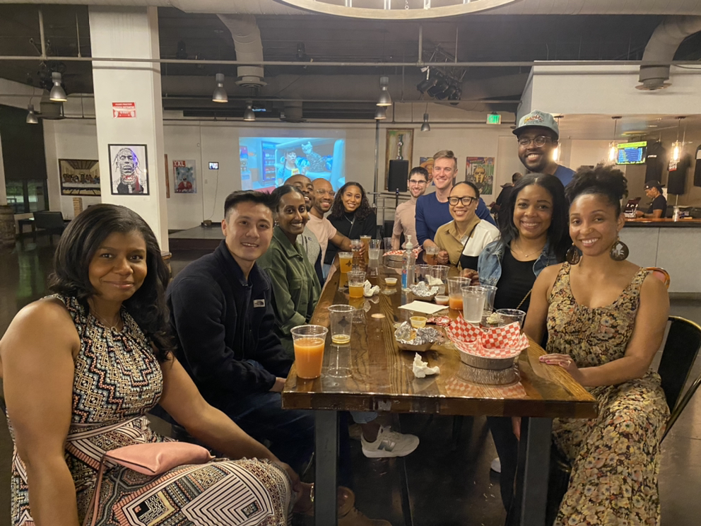 Group of residents pose for photo at a table