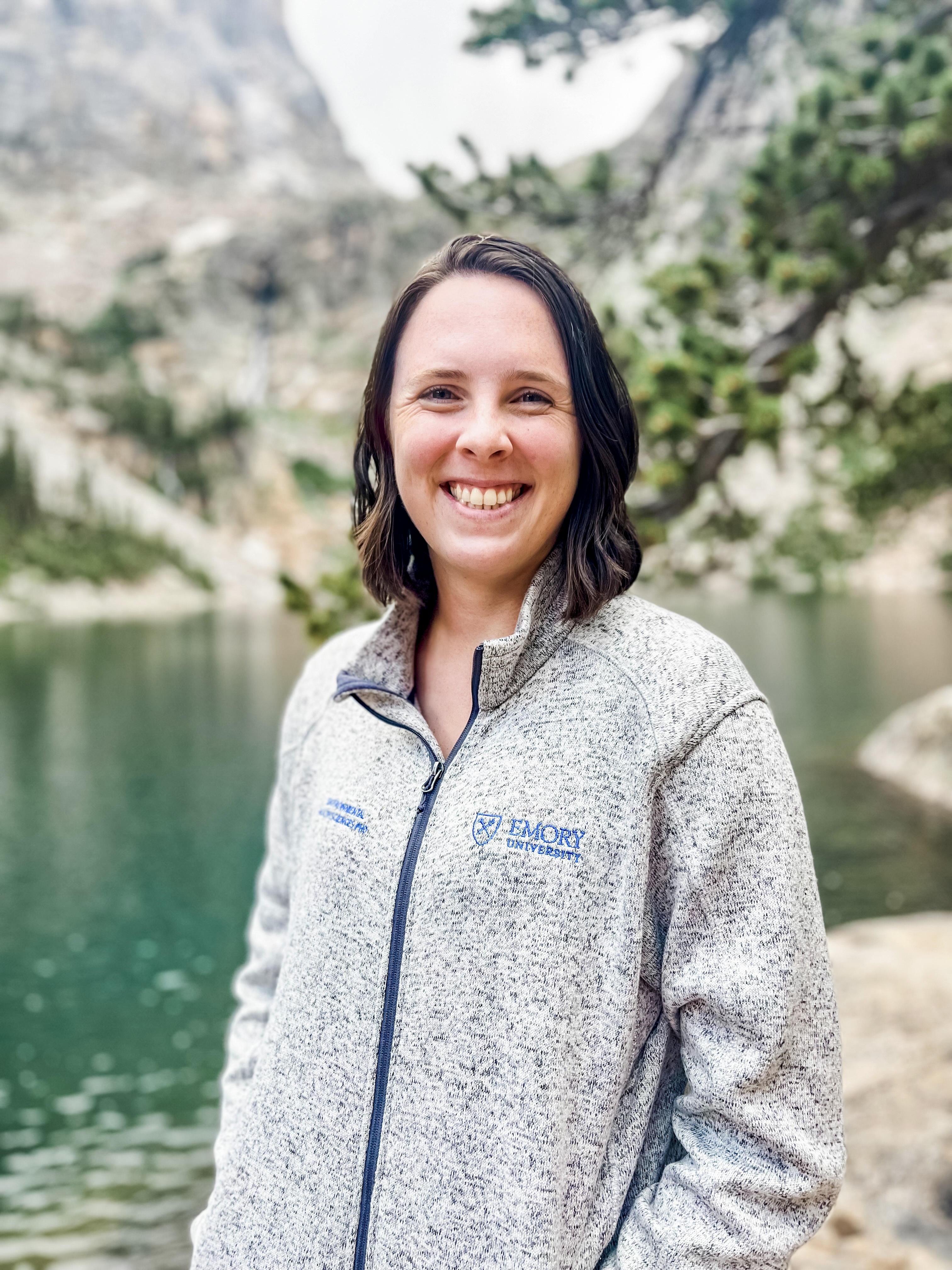 Steph Bellman smiling, wearing an Emory University sweater