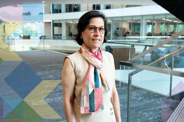 woman with short black hair wearing a colorful scarf 