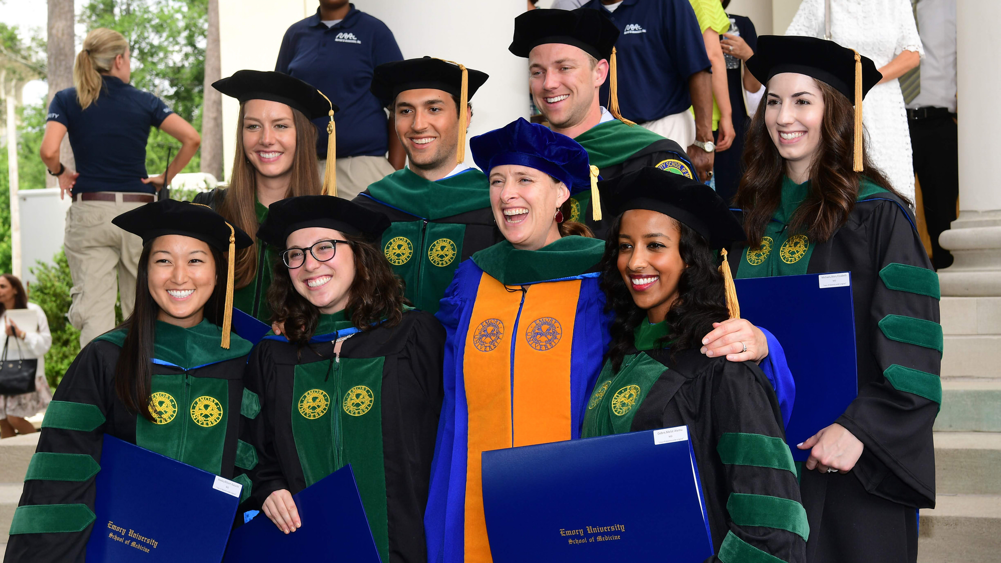 Faculty and students in cap and gown