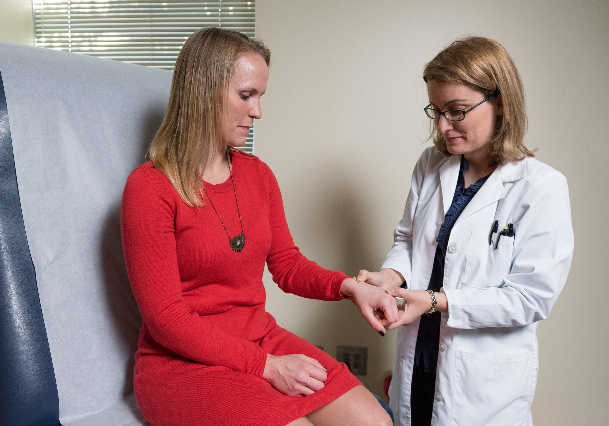 Woman being shown microneedle patch