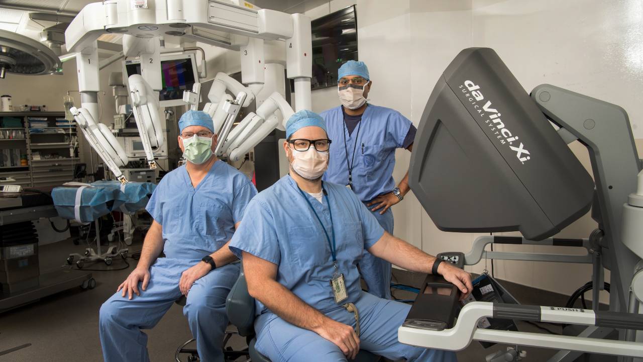 three men with medical equipment